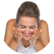 Female splashing water on her cleansed face